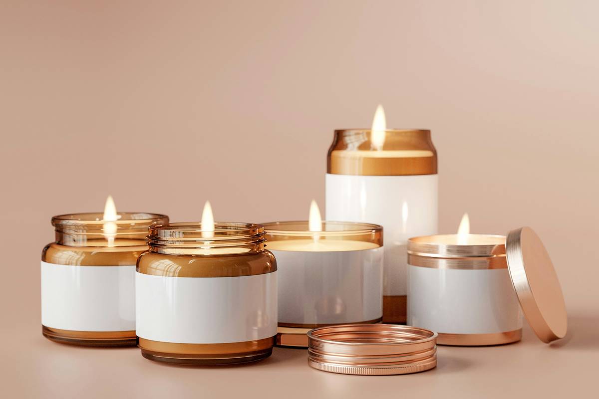 Hand-poured candles for home scented arranged on rustic wooden shelf with dried lavender and matchsticks